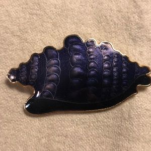 Purple shell pin/brooch.
